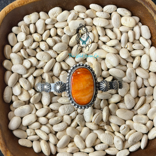 The Orange Spiny Stardusted Cuff